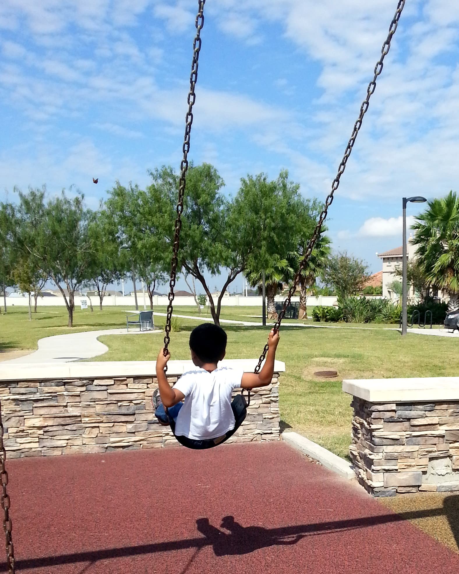 Child on a swing- park