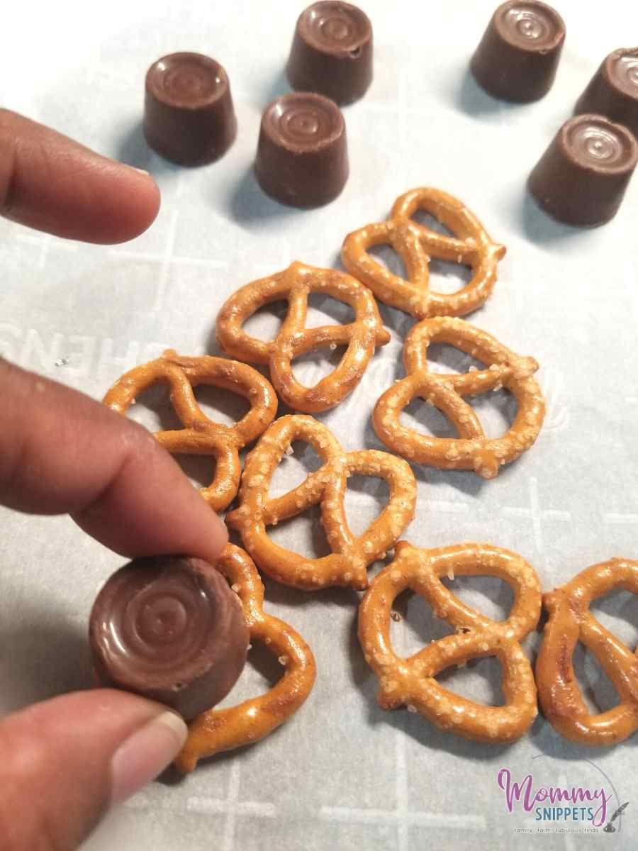 placing a Rolo on a mini pretzel twist