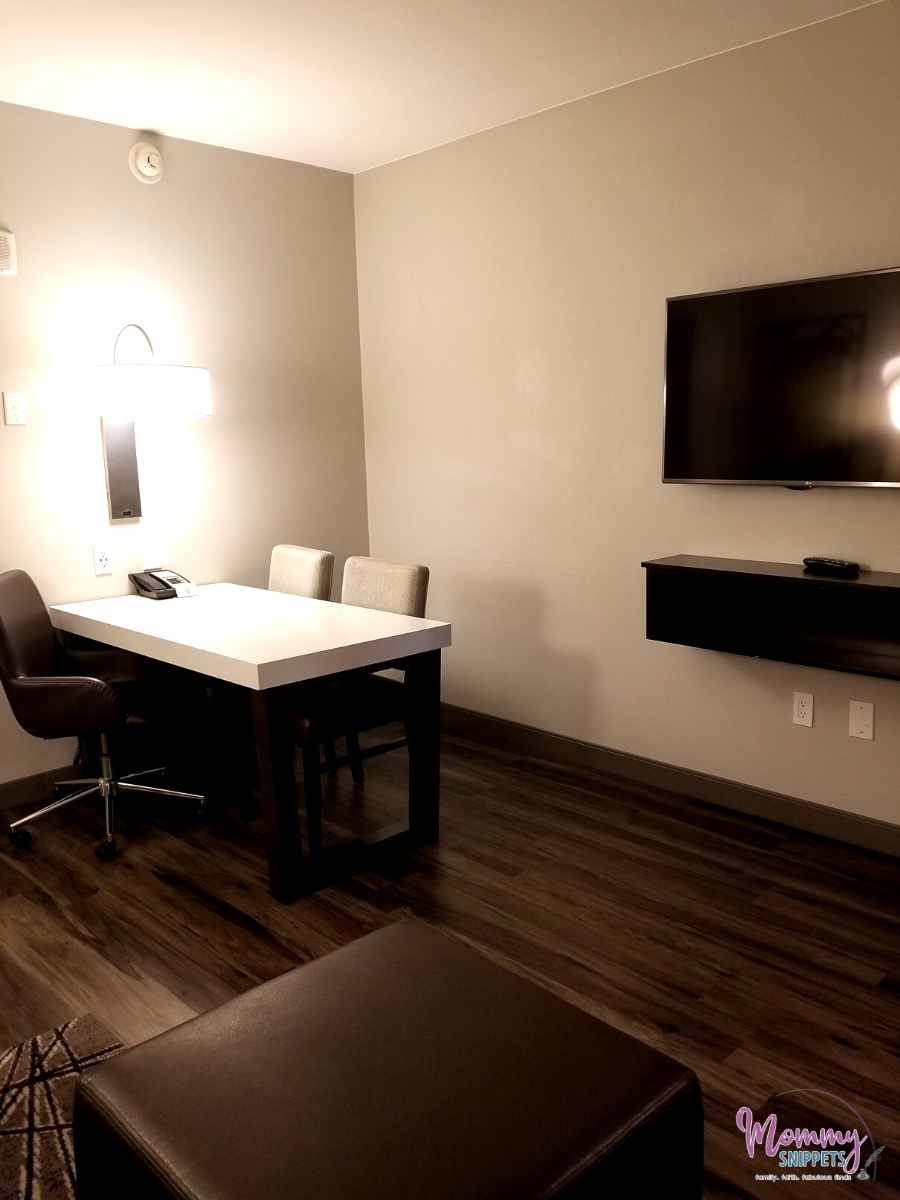 work space and table in a suite in the Embassy Suites by Hilton Houston Energy Corridor