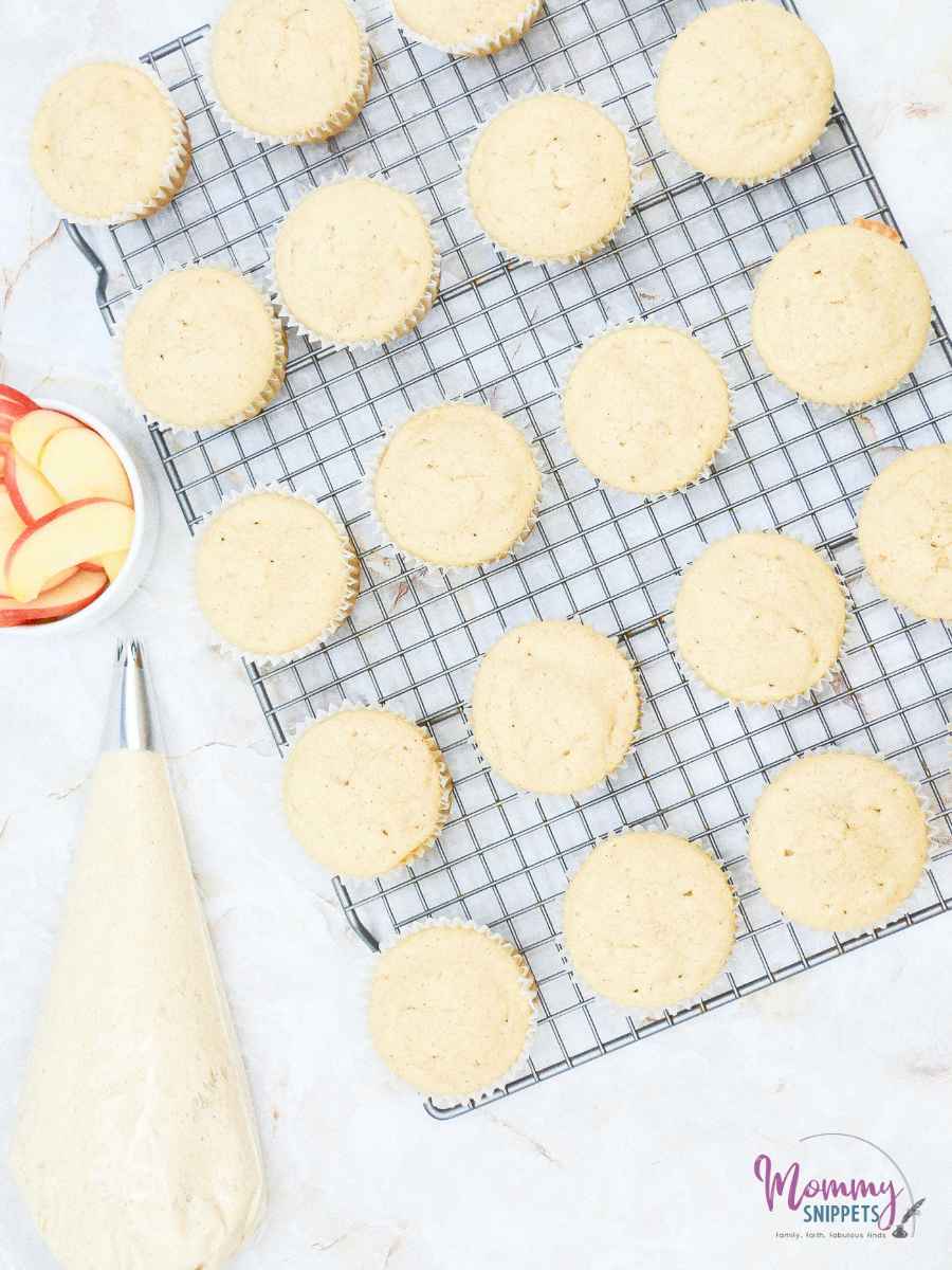 apple cider cupcakes cooling on cooking rack